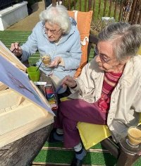 Metchley Manor's residents have been painting the home’s garden and sharing their skills with their grandchildren.