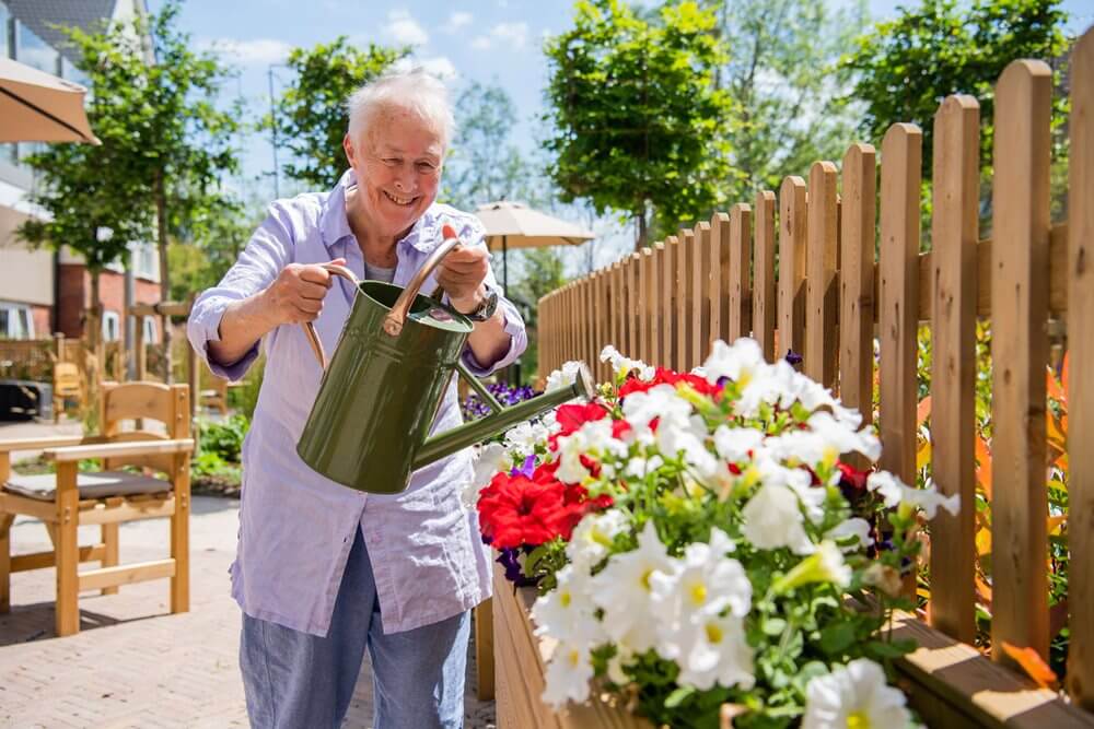 A resident at Heathlands House enjoying the garden